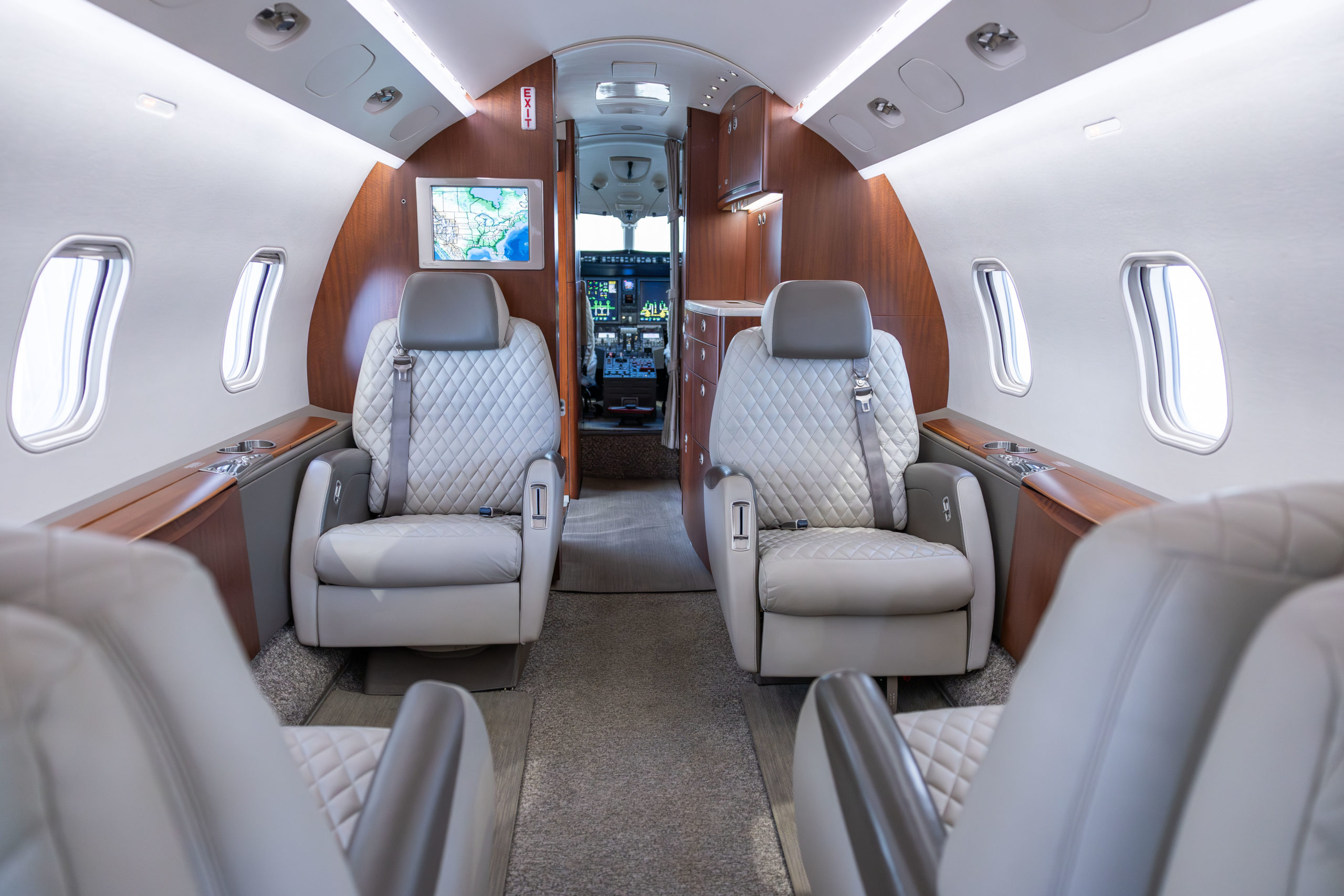 Interior of a private aircraft showing cabin seating and cockpit, reflecting how modern aviation buyers research high-value decisions.